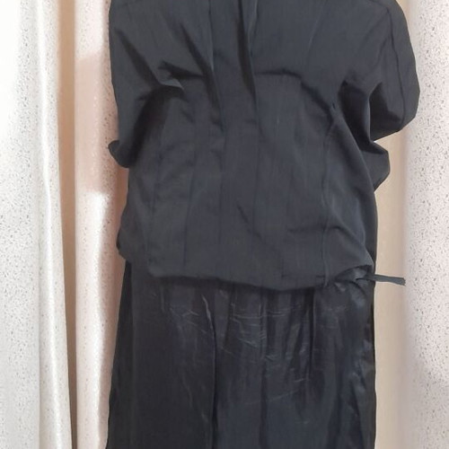 VS black sleeveless dress with round neckline and pleats, size 50