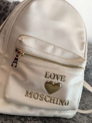 Love Moschino white backpack like new with gold details