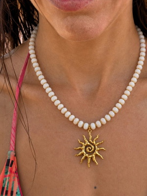Handmade white and gold necklace with sun pendant