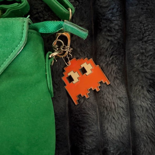 Green suede crossbody bag used with gold details