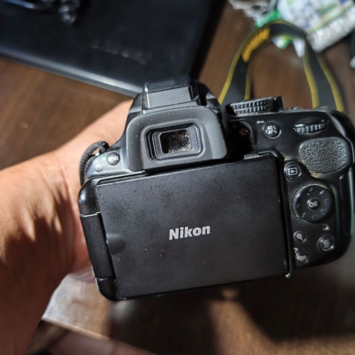 Nikon D5200 DSLR with Nikkor 35mm f/1.8G lens and accessories