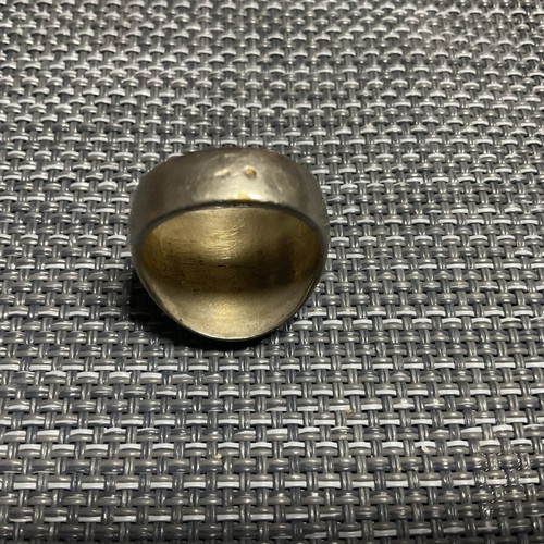 Men's metal ring used with signs of wear
