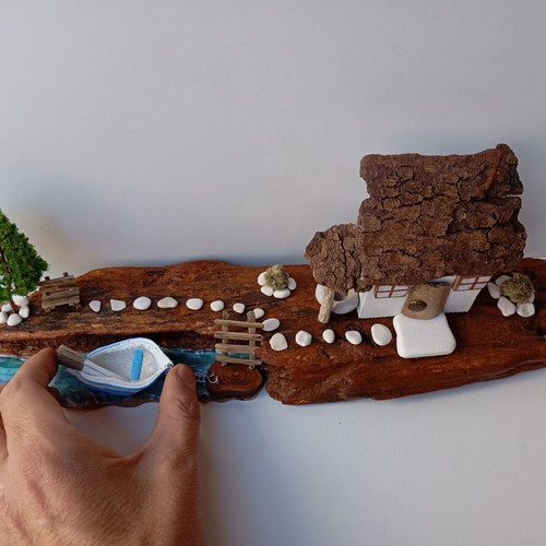 Handmade sea-themed driftwood diorama with Greek island house