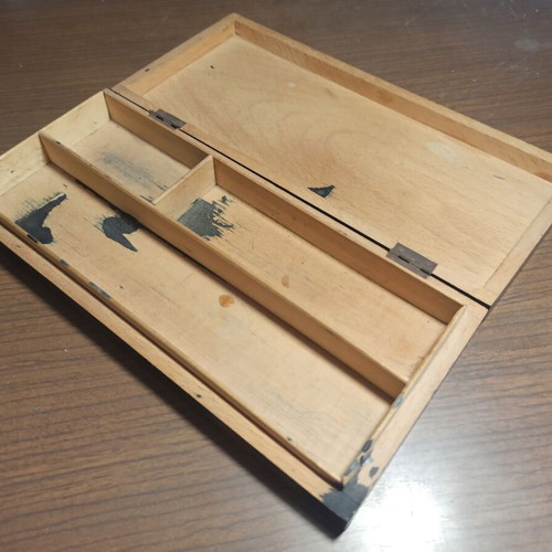 Wooden stationery box with used pencils and ink cartridges set
