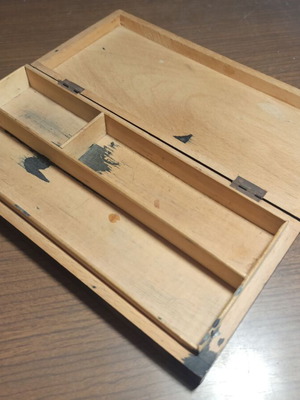 Wooden stationery box with used pencils and ink cartridges set