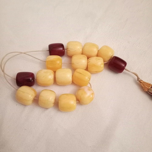 Worry beads with synthetic resin beads in yellow and burgundy, like new