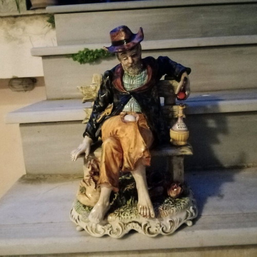 Italian porcelain vintage figure of old man with wine jug and pipe used