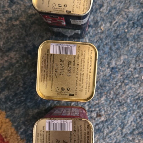 Set of three tin piggy banks like new from England