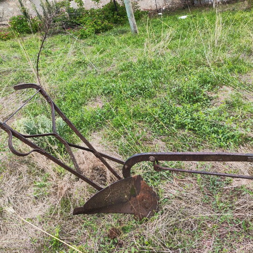 Antique plow used for garden decoration