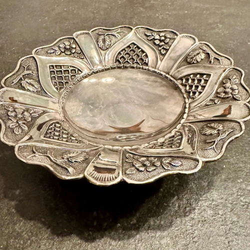 Vintage bowl with silver lining and engraved design, used