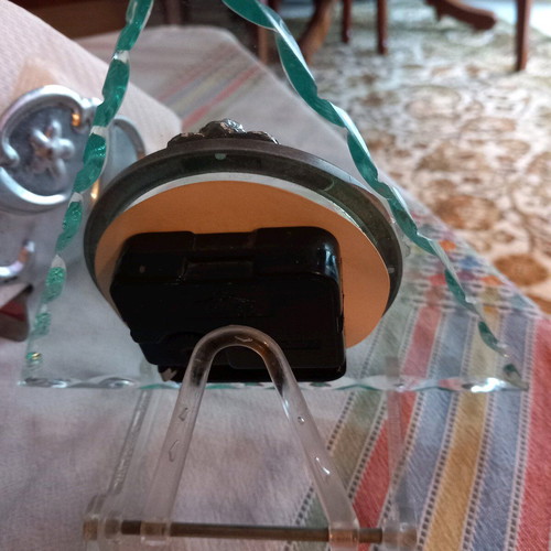 Decorative clock used, tabletop with wooden and glass base