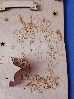 Wooden decorative plaque like new with unicorn and clip