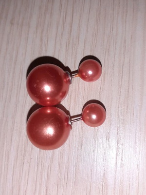 Earrings new with small white and large orange pearl