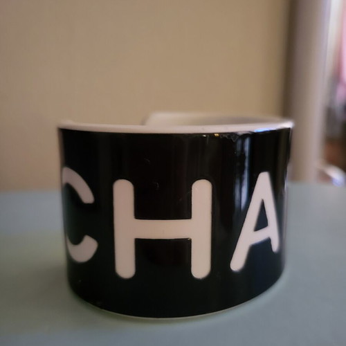 Cuff bracelet like new, black resin with white letters