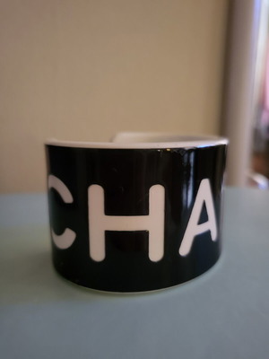 Cuff bracelet like new, black resin with white letters