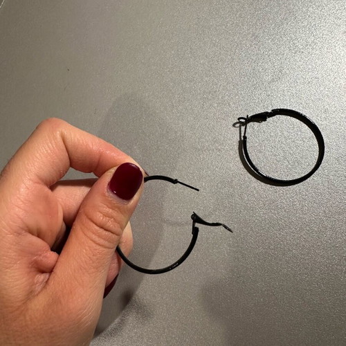 Black hoop earrings used, medium size