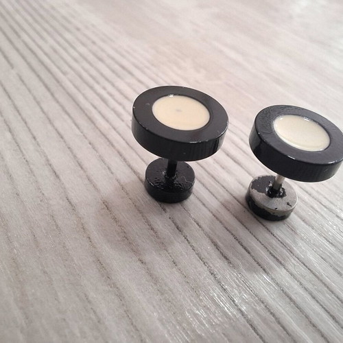 Barbell piercing earrings used, black and white, bar style