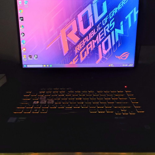 ASUS ROG Strix G531GT gaming laptop with headphones and keyboard