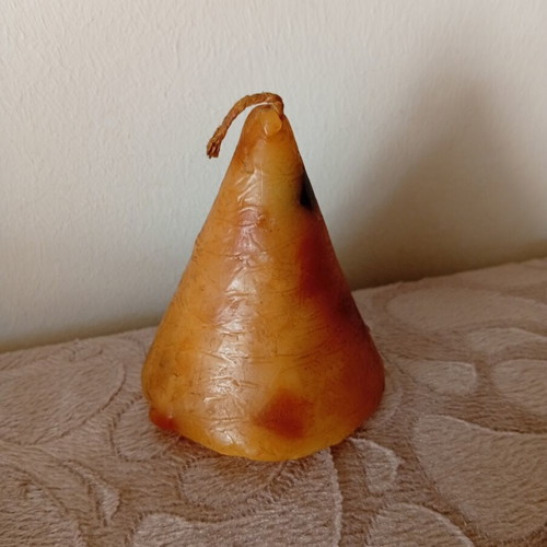 Cone candle used, unlit with dark wick