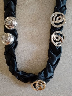 Handmade women's necklace with black fabric braid and decorative buttons like new