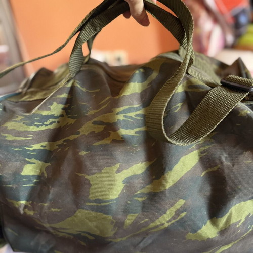 Military camouflage bag with straps used