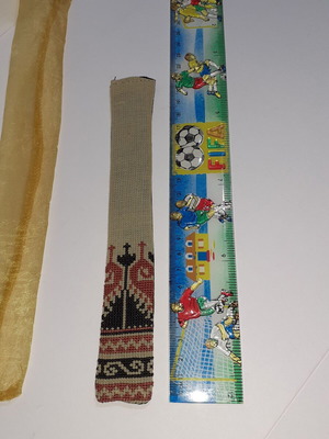 Handmade bookmark with embroidered pattern in black and ecru