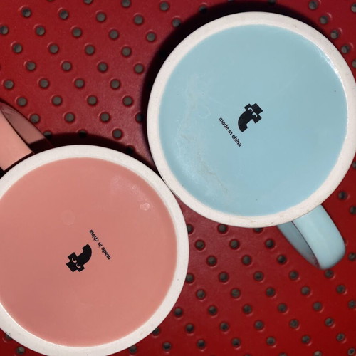 Set of 2 glass mugs used, pastel colors with prints