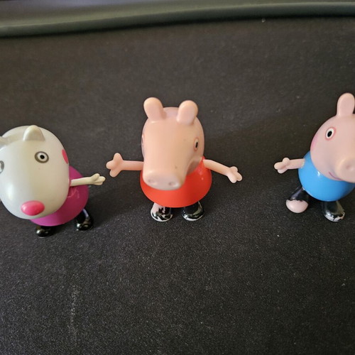 Peppa and Minnie figures used with minor paint wear
