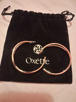 Oxette earrings new, gold color