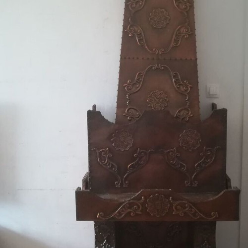 Decorative fireplace set with table and copper wall plaque