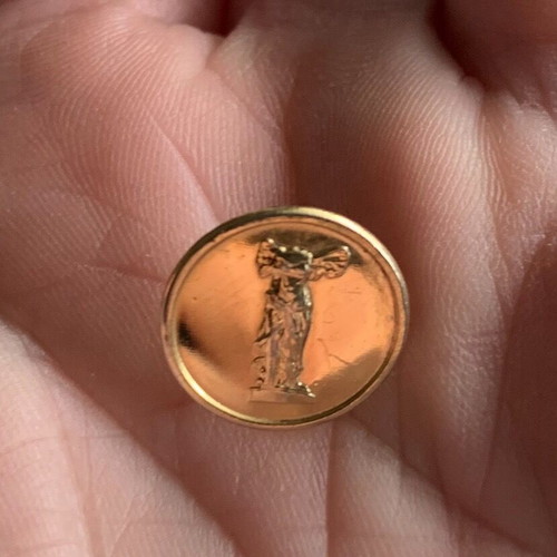Gold-plated pin badge 'Nike of Samothrace' used