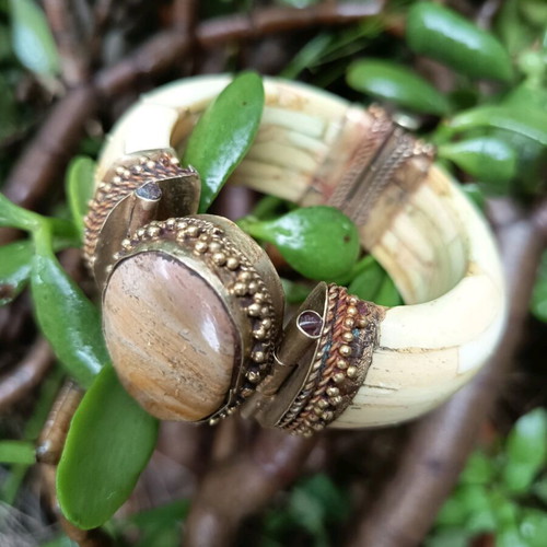 Boho bracelet used with bronze details beige