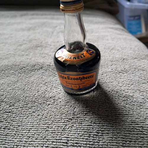 German liqueur with handmade costume like new