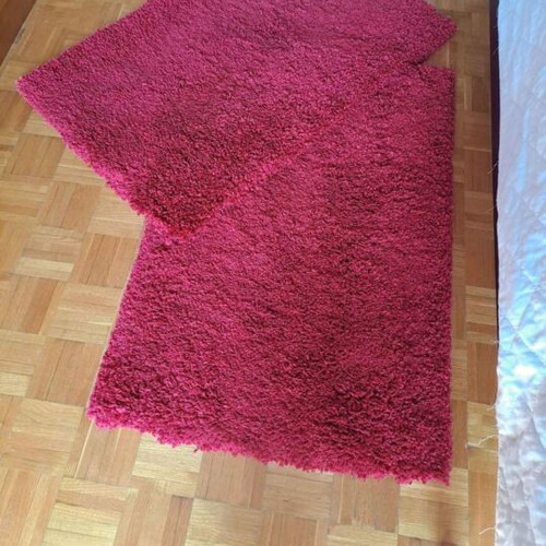 Shaggy red rugs with high pile, 2 rectangular and 1 round