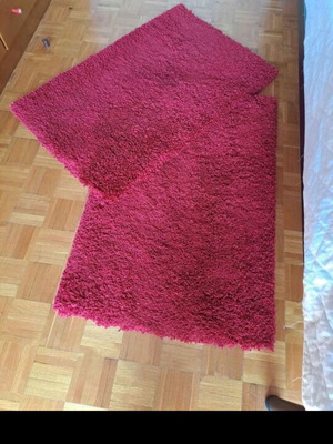 Shaggy red rugs with high pile, 2 rectangular and 1 round