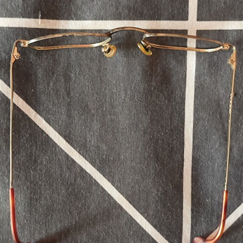 Vogue eyeglass frame used, gold color