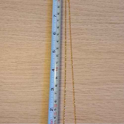 Necklace with gold tone chain and silver round pendant like new