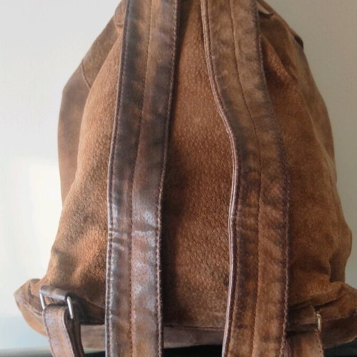 Handmade leather backpack used with adjustable straps