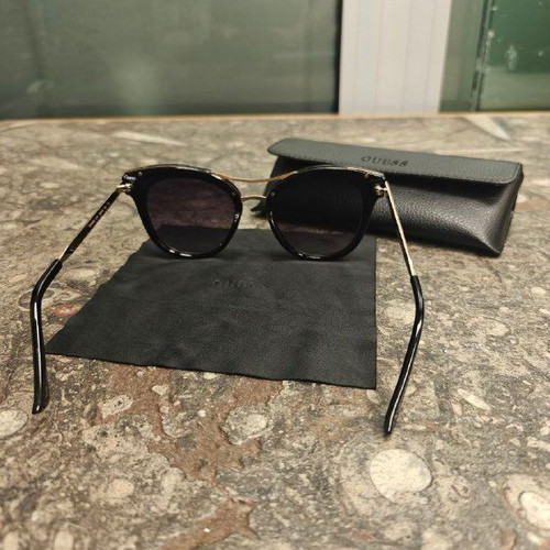 Guess women's sunglasses with black protective case and cloth