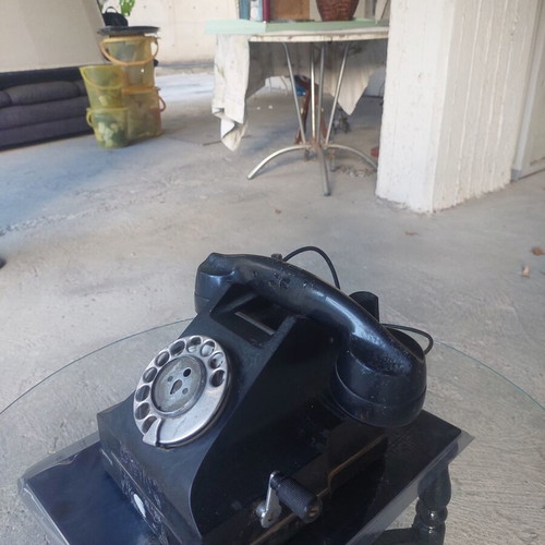 Antique telephone used, black corded