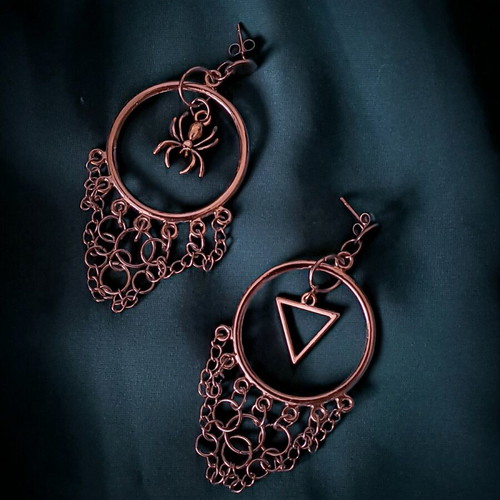 Asymmetric earrings handmade from stainless steel