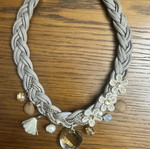 Handmade statement necklace with grey braided cord and fabric flowers