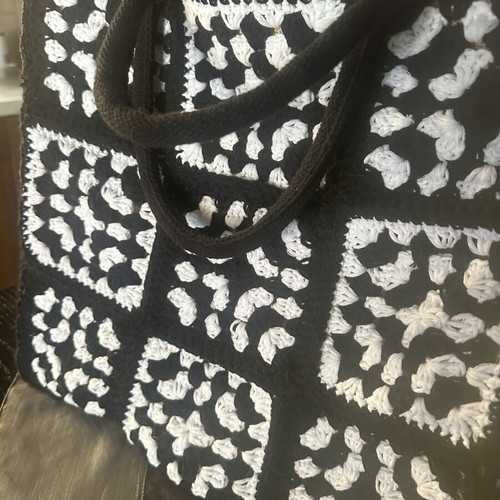Handmade jute bag with black and white crochet motifs