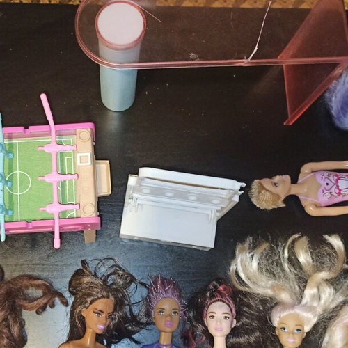 Barbie and other toys used, in moderate condition