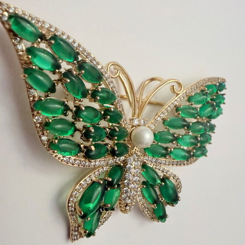 Vintage butterfly brooch with green cabochon stones and white zircon, like new