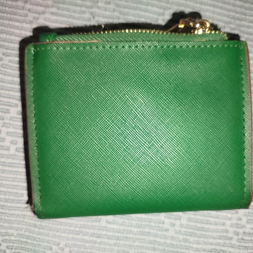Small green wallet used
