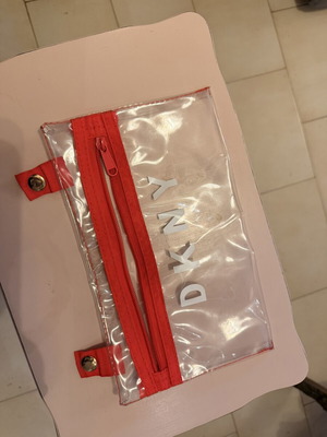 DKNY transparent pouch like new with red zipper