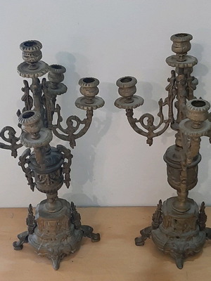Bronze candlesticks used, pair with patina and carved base