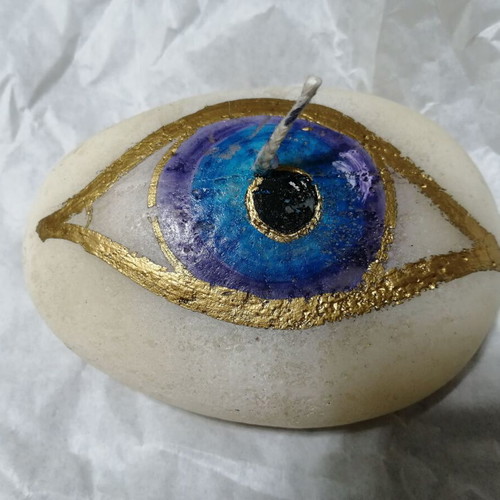 Candle in pebble shape with painted eye new