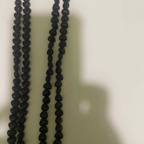 Long necklace with black heart-shaped beads like new